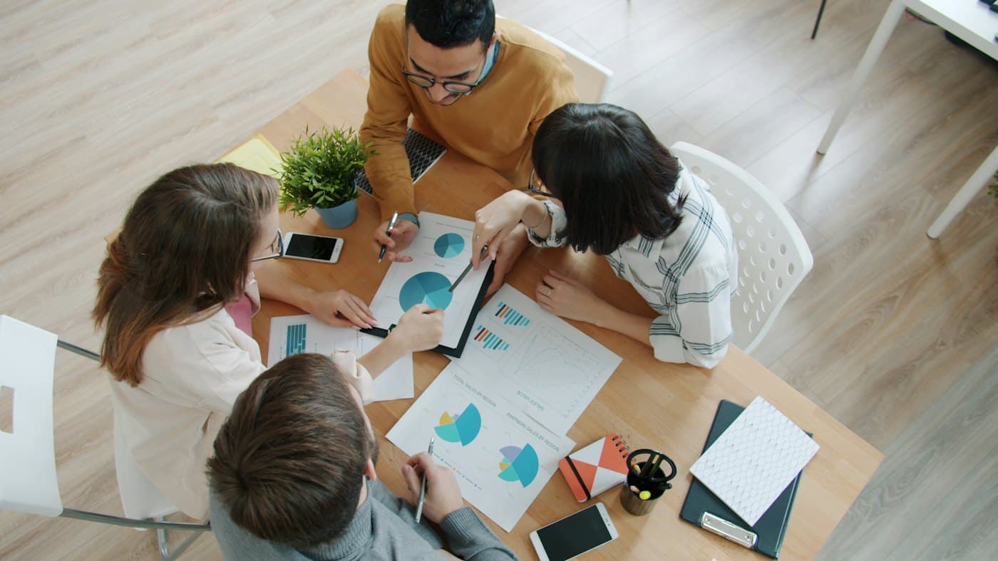 A team reviewing marketing data together around a table